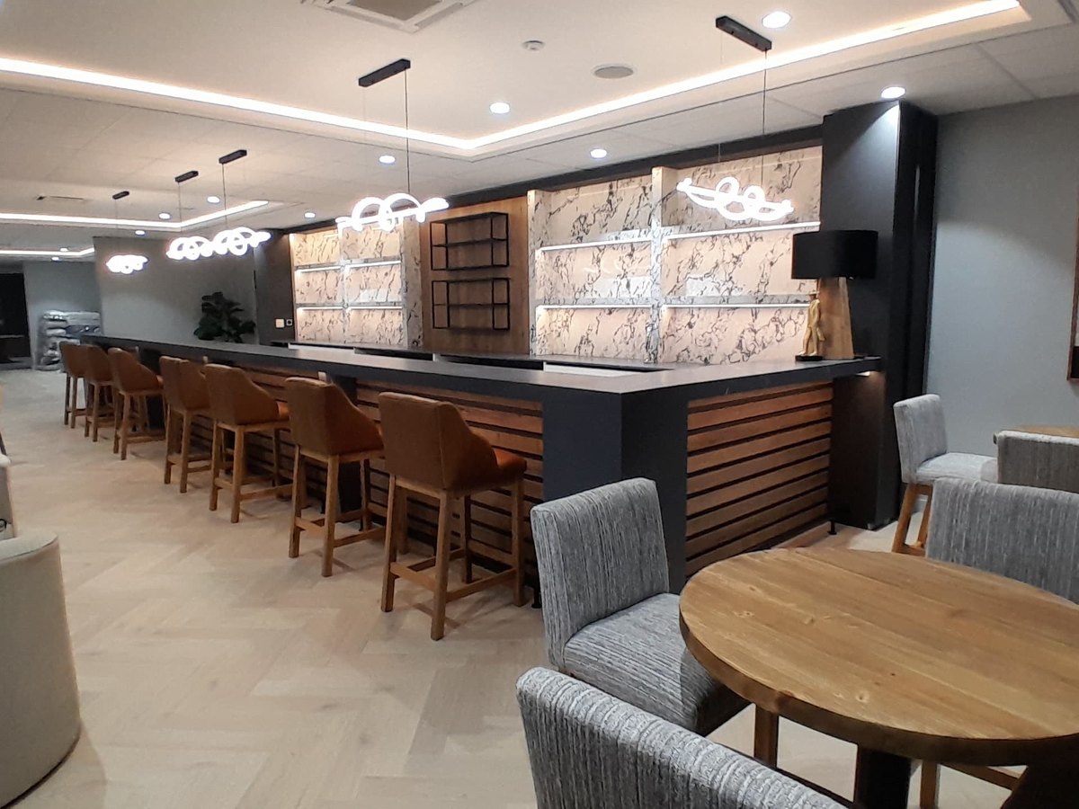 Bar counter and seating in a finished hospitality interior