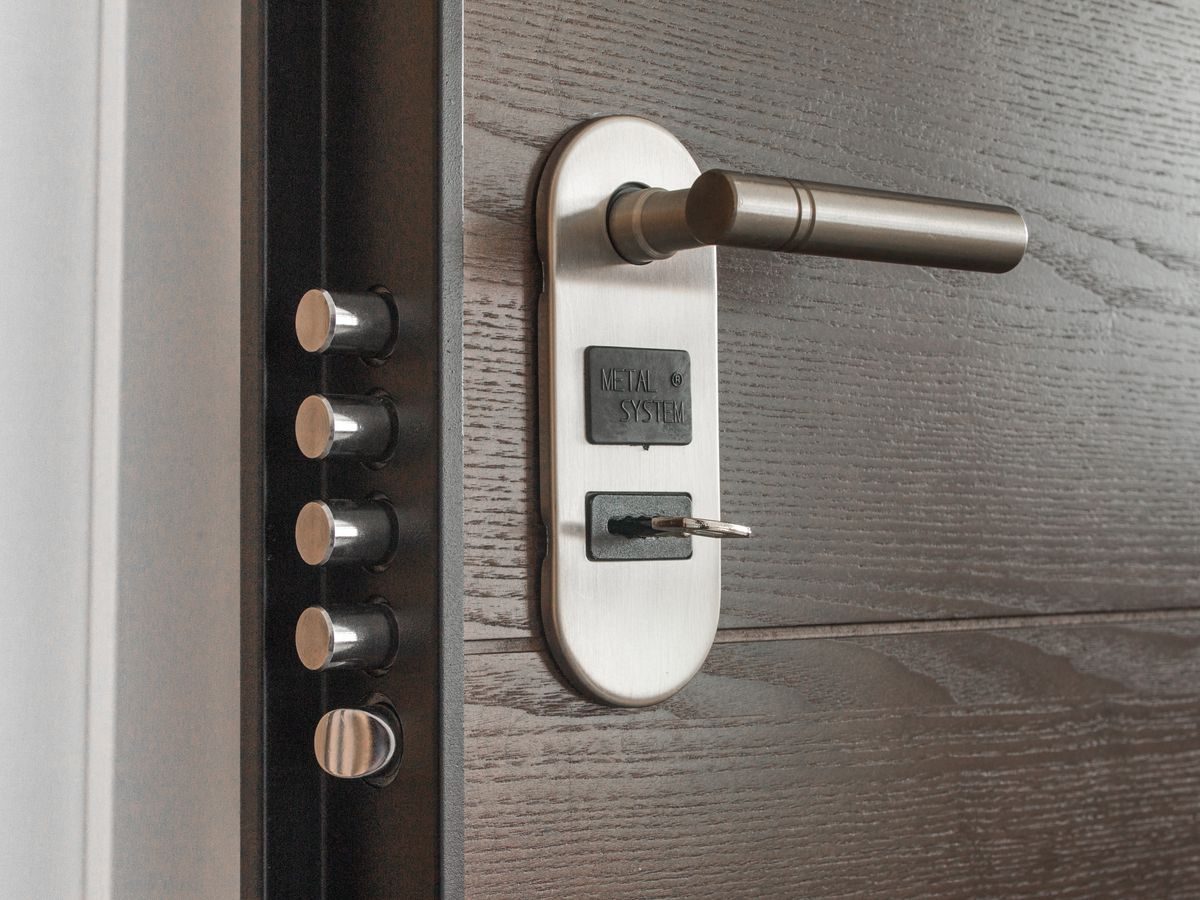 Close-up of a door handle and lock set on a timber door