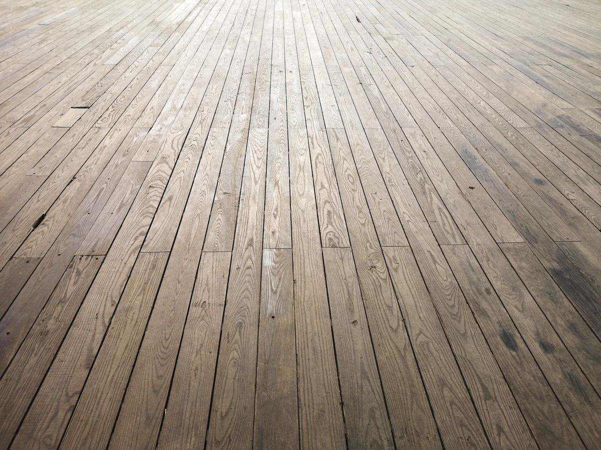Wide-plank laminated floor laid the length of a passage