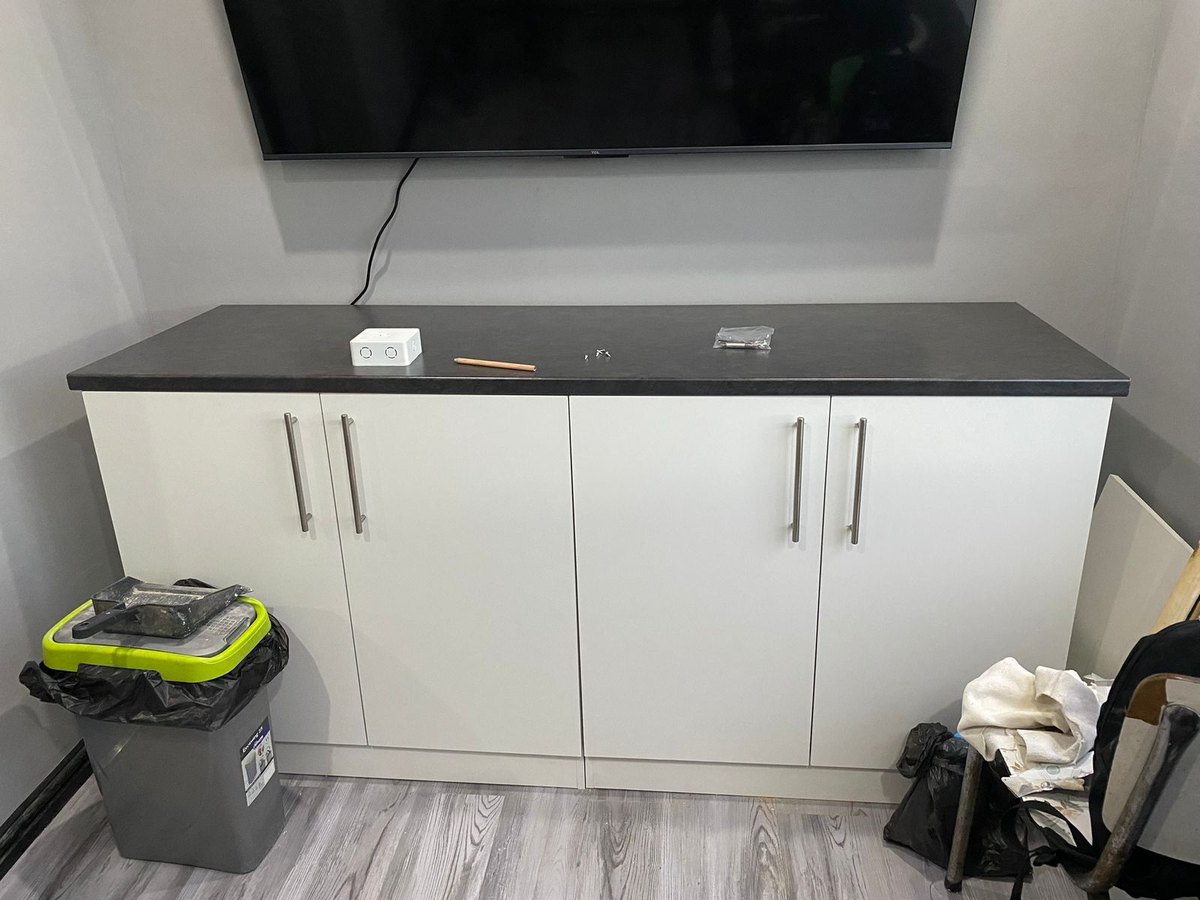 Built-in sideboard and TV unit with a dark top