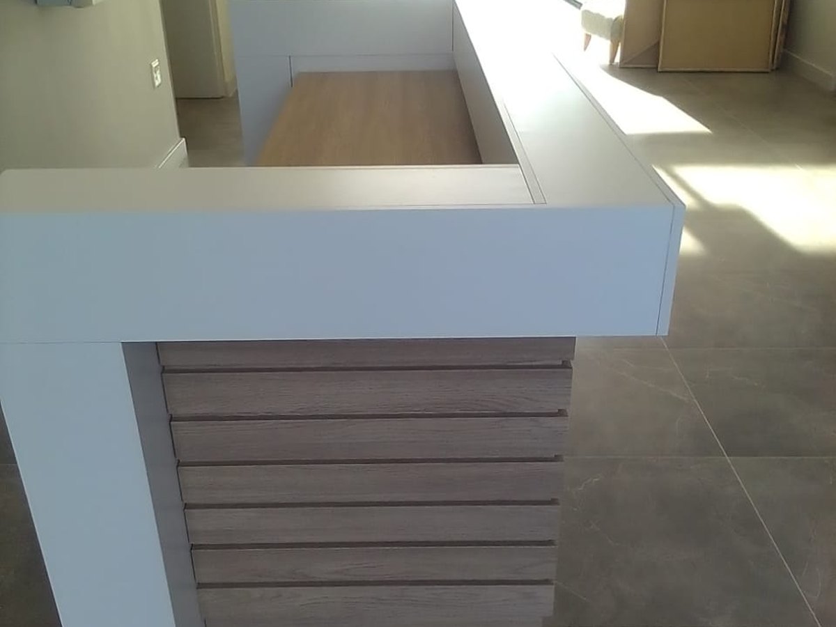 Counter with a slatted timber front and stone top