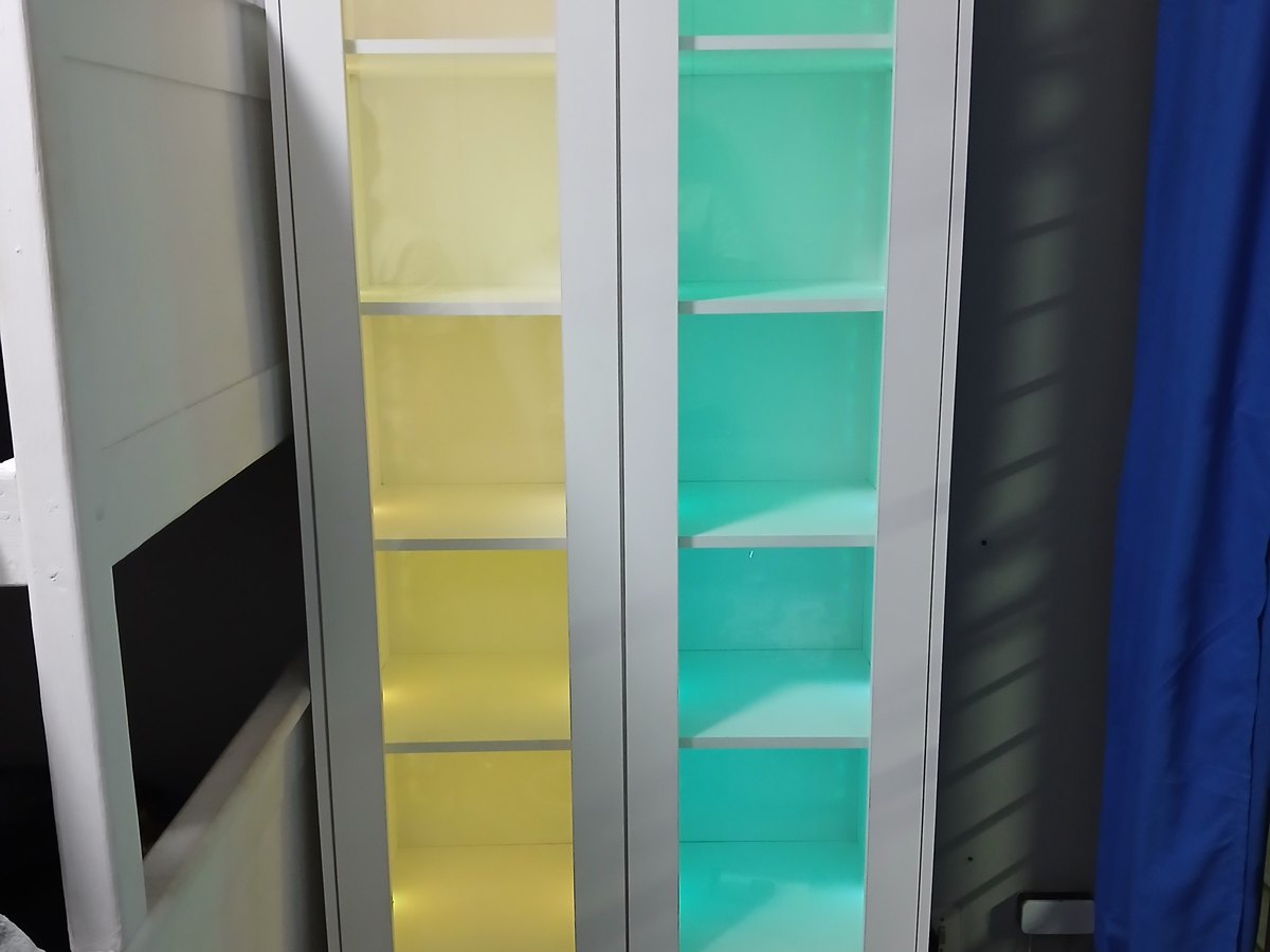 Backlit display unit with coloured glass panels