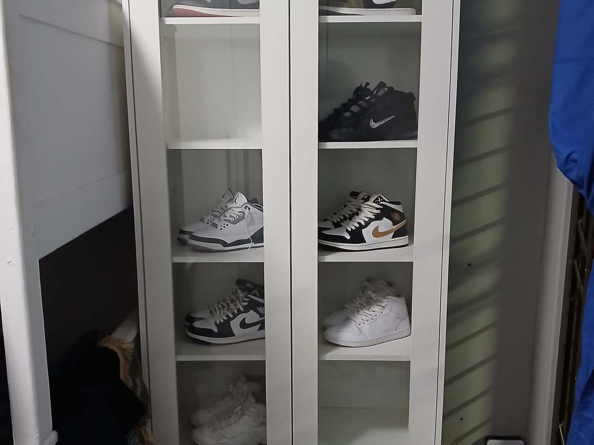 Glass-fronted display cabinet built into a wall