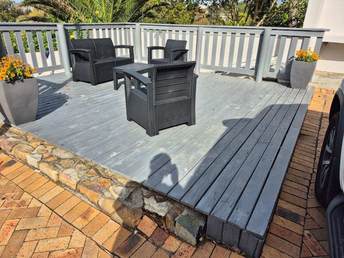 Painted and sealed timber deck with outdoor seating